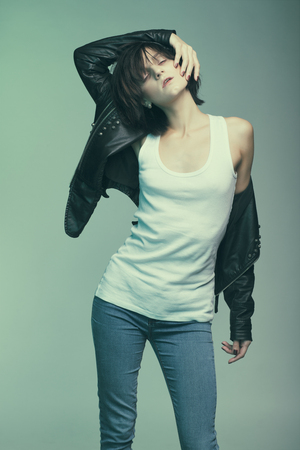 Androgyny female model in Heroin chic style. Old style tinted imageの写真素材