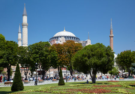 ISTANBUL, TURKEY - JULY 10, 2014: The lawn and the  trees of Sultan Ahmet Park with Hagia Sophia in the background, Istanbul, Turkeyのeditorial素材