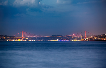 The twilight view of the Bosphorus with the illuminated Bosphorus bridge. Istanbul, Turkey.の写真素材