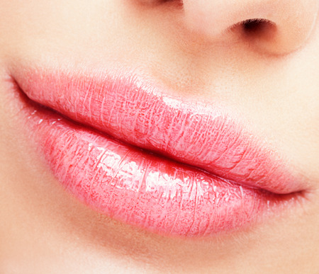 Closeup shot of female mouth with makeup in Rose Quartz lips colorの写真素材
