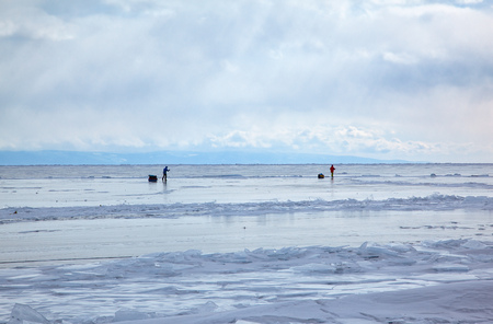 Tourists traveling on Baikal Lake in Siberia at winter timeの写真素材