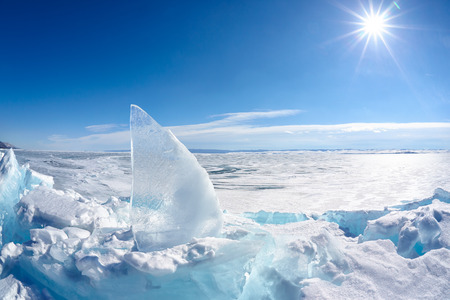 Ice floe and sun over winter Baikal lakeの写真素材