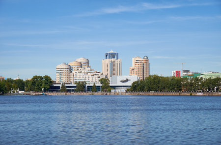 YEKATERINBURG, RUSSIA - MAY 26, 2015:  View of the complex modern residential buildings and the building of cinema and concert theater Kosmos on the embankment of river Iset in Ekaterinburg, Russiaのeditorial素材