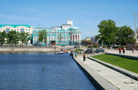 YEKATERINBURG, RUSSIA - MAY 26, 2015:   Iset river embankment on Lenin Prospekt with view on Home Sevastyanov and the administration building of the Governor of Sverdlovsk region, Ekaterinburg, Russiaのeditorial素材
