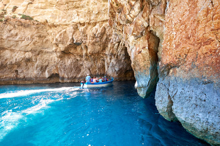 MALTA - JULY 27, 2015: Group of to?rists visit Blue Grotto - famous sea cave on south part of Malta islandのeditorial素材
