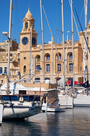 Birgu, MALTA - JULY 24, 2015: The yachts and boats moored in the harbor in Dockyard creek in front of Malta Maritime Museum. Malta.のeditorial素材