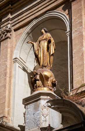 Valletta, MALTA - JULY 24, 2015: The statue of Immaculate Conception on facade of the St Barbara Church in the Republic street, Valletta, Maltaのeditorial素材