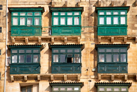A traditional Maltese style different colored  balconies in Valletta. Malta.の写真素材