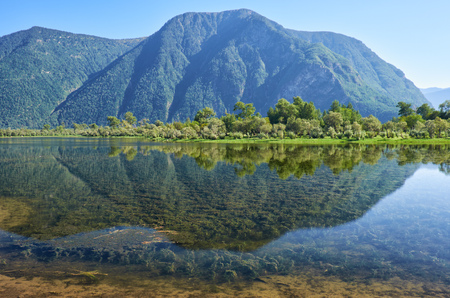 Shallow bay on South part of Lake Teletskoye in the mouth of the river Chulyshman in Altay mountainsの写真素材