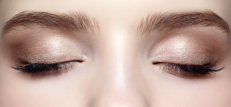 Closeup shot of closed female face with eye  day makeupの写真素材