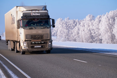 ALTAI, RUSSIA - JANUARY 18, 2017: Volvo truck on road M52 Chuysky Tract in winter seasonのeditorial素材