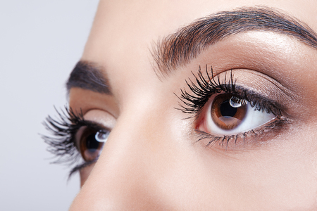 Closeup shot of female eye with day makeup eyes shadowsの写真素材