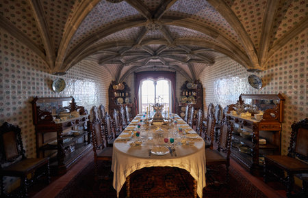 SINTRA, PORTUGAL - JULY 03, 2016: The interior of the Pena Palace. The royal dining room with the table served for the guests arrival. Pena Palace. Sintra. Portugalのeditorial素材