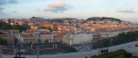 LISBON, PORTUGAL - JUNE 24, 2016: The fascinating panoramic view of the city, which is opening from the terrace of San Pedro de Alcantara garden (Antonio Nobre garden) at sunset. Lisbon. Portugalのeditorial素材