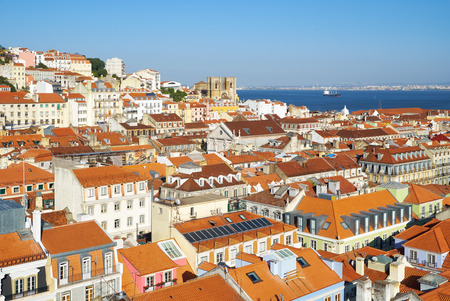 The residential houses of Alfama with Tejo river on the background as seen from the observation platform of Santa Justa Lift. Lisbon. Portugalの写真素材