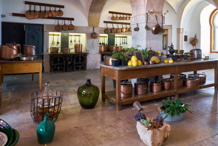 SINTRA, PORTUGAL - JULY 03, 2016: The interior of the old kitchen with different kittenware: pots, pans and bottles in the Pena Palace, Sintra, Portugalのeditorial素材