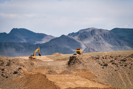 KHOVD, MONGOLIA - JULY 06, 2017:  Road construction in Mongolia. Excavators and dump truck performs earthworks.のeditorial素材