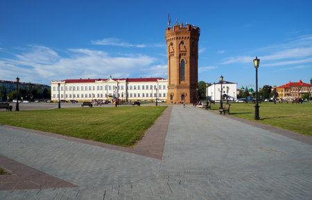 TOBOLSK, RUSSIA - AUGUST 11, 2016: The Water tower in the center of Red square with the Tobolsk Theological Seminary on the background. Tobolsk. Russiaのeditorial素材