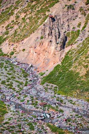 Mountain mongolian natural landscape. River Ih Sair with mushroom-like geologic structures on steep...