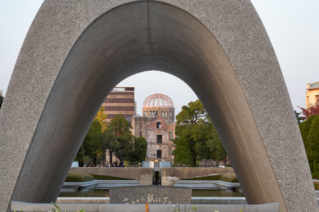 HIROSHIMA, JAPAN â NOVEMBER 23, 2007: The view of Atomic Bomb Dome through the arch of Memorial Cenotaph for the A-bomb Victims in Peace Park. Hiroshima. Japanのeditorial素材
