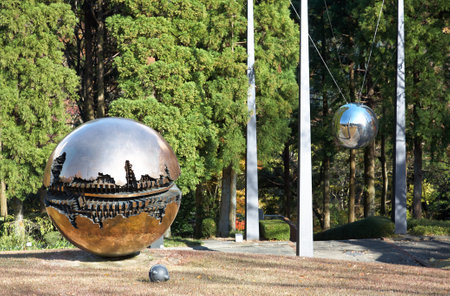 HAKONE, JAPAN - DECEMBER 01, 2007: A bronze sculpture Sfera con Sfera (sphere within a sphere) by Arnaldo Pomodoro in the Hakone Open Air Museum at autemn. Kanagawa. Japanのeditorial素材