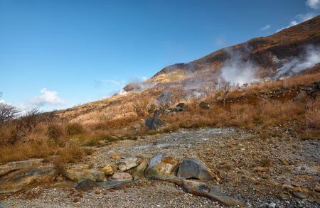 The sulfurous fumes on the brimstone coated slope of Owakudani (The Great Boiling Valley). Hakone area. Kanagawa Prefecture. Honshu. Japanの写真素材