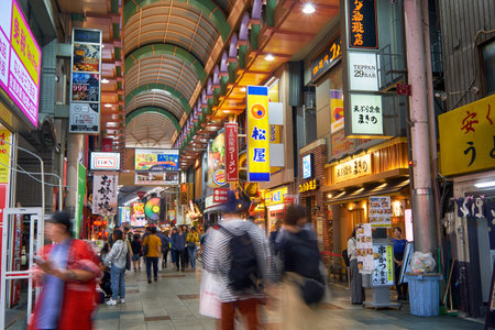 OSAKA, JAPAN - OCTOBER 14, 2019:  The view of Doguyasuji, a covered  shopping street  in Namba (Minami) lined with different stores and bars. Nightlife in Osakaのeditorial素材