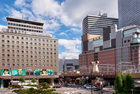 OSAKA, JAPAN - OCTOBER 15, 2019:  The modern high-rise buildings and road junctions in the urban center surrounding the Osaka station. Japanのeditorial素材