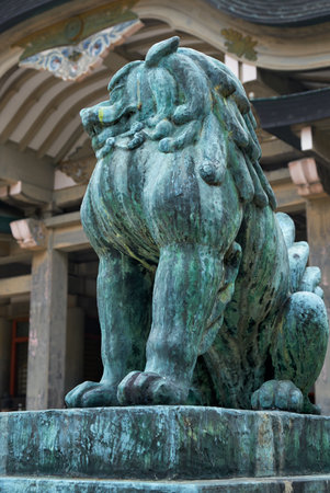 Un-gyo  Komainu lion-dog with the mouth closed, guarding the entrance of Hokoku Shrine in Osaka Castle. Osaka. Japanのeditorial素材