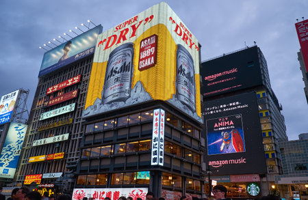 OSAKA, JAPAN - OCTOBER 14, 2019: The view of  gaudy neon lights and signage of night Dotonbori. Osaka. Japanのeditorial素材