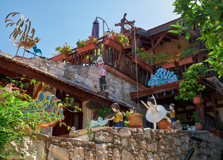 LANEIA, CYPRUS - JUNE 09, 2018: The courtyard inventively decorated with dolls live scenes in the residential house of Laneia village.  Limassol. Cyprusのeditorial素材