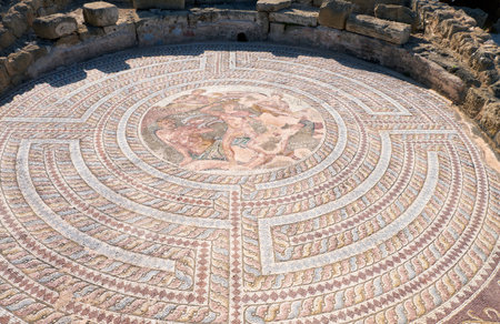 PAPHOS, CYPRUS - JUNE 08, 2018: Mosaic of duel of Theseus and Minotaur in the labyrinth of Crete, found in the southeast quarter of House of Theseus. Paphos Archaeological Park. Cyprusのeditorial素材