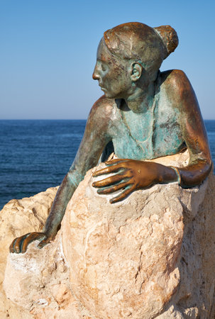 PAPHOS, CYPRUS - JUNE 08, 2018: Sol Alter by Yiota Ioannidou â a sculpture of young woman that pays homage to Aphrodite, on coastal Broadwalk. A part of an open air museum of Paphos. Cyprusのeditorial素材