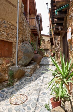 The narrow street of old Kakopetria village surrounded by traditional houses with wooden balconies extending from the second floor. Nicosia District. Cyprusの写真素材