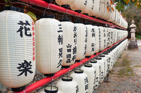 KYOTO, JAPAN - OCTOBER 17, 2019: The view of hundreds traditional white paper lightings (chochin) at Hirano Shrine. Kyoto. Japanのeditorial素材