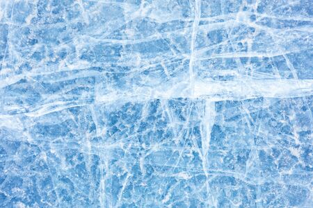 Surface of winter ice on Baikal lake in Siberia . Blue background of Ice texture