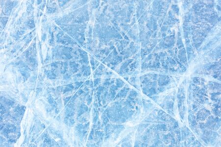 Surface of winter ice on Baikal lake in Siberia . Blue background of Ice texture