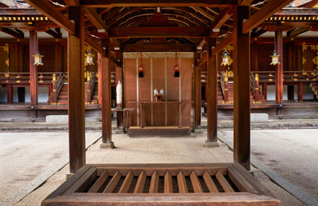 The wooden offering box (saisen) for collecting coins from worshipers in front of the  entrance to the Hirano Shrine. Kyoto. Japanのeditorial素材