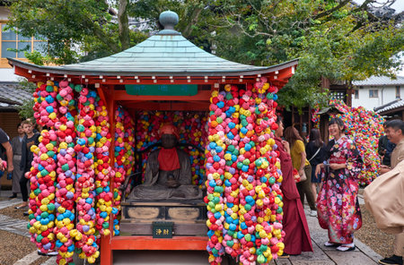 KYOTO, JAPAN - OCTOBER 18, 2019: Statue of Shomen Kongo, a deity with healing powers surrounded by...