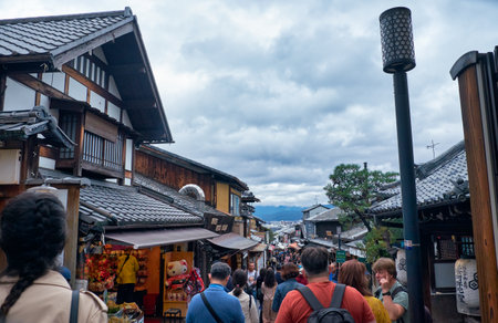 KYOTO, JAPAN - OCTOBER 18, 2019:  The crowded with people Matsubara-dori street full of cafe and souvenir shops near Kiyomizu-dera temple. Kyoto. Japanのeditorial素材