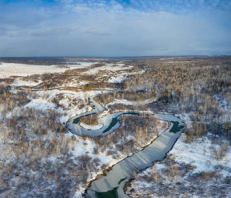 Aerial photo panorama of Koen river under ice and snow. Beautiful winter landscape. Novosibirsk, Siberia, Russiaの写真素材