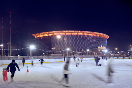 Yekaterinburg, Russia - January 03, 2021: The night view of ice rink in front of brightly illuminated Ekaterinburg Arena (Central Stadium). Yekaterinburg. Russiaのeditorial素材