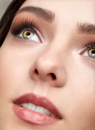 Closeup shot of human female face. Woman with natural face and eyes beauty makeup.の写真素材