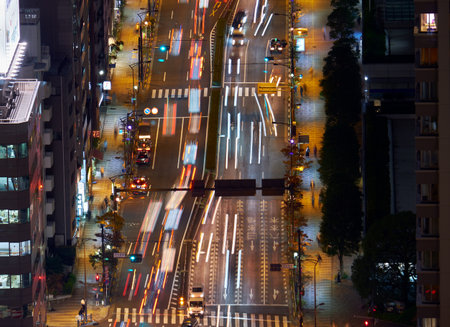 The view of the blurry night road lights as seen from the Tokyo Tower main observation deck. Japan