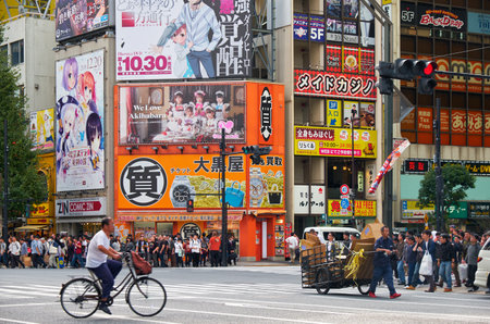 Tokyo, Japan - October 26, 2019: The view of Akihabara crossroads surrounded by the many manga,...