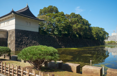 Kikyo-mon Gate (Uchi Sakurada-mon Gate) with the Kikyo-bori moat around Tokyo Imperial Palace on the foreground. Tokyo. Japanのeditorial素材