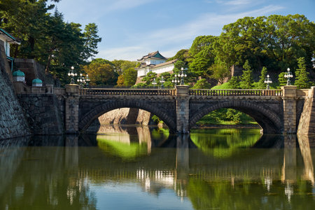 Seimon Ishibashi Bridge leads to the main gate of Imperial Palace. It is known as the Eyeglasses Bridge (Meganebashi) because of its stone-arch reflecting in the water of Nijubashi-moat. Tokyo. Japanのeditorial素材