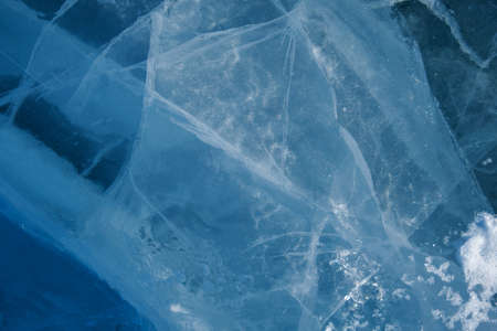 Texture of winter ice surface. Blue natural ice background.