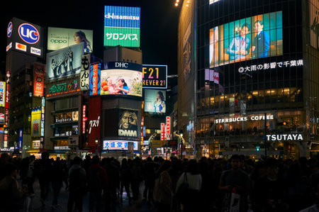 Tokyo, Japan - October 25, 2019: The night view of one of the busiest crossing in the world, Shibuya Crossing or Shibuya Scramble Crossing in front of the Shibuya Station. Tokyo. Japanのeditorial素材