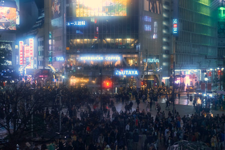 Tokyo, Japan - October 25, 2019: The night view of one of the busiest crossing in the world, Shibuya Crossing or Shibuya Scramble Crossing in front of the Shibuya Station. Tokyo. Japanのeditorial素材